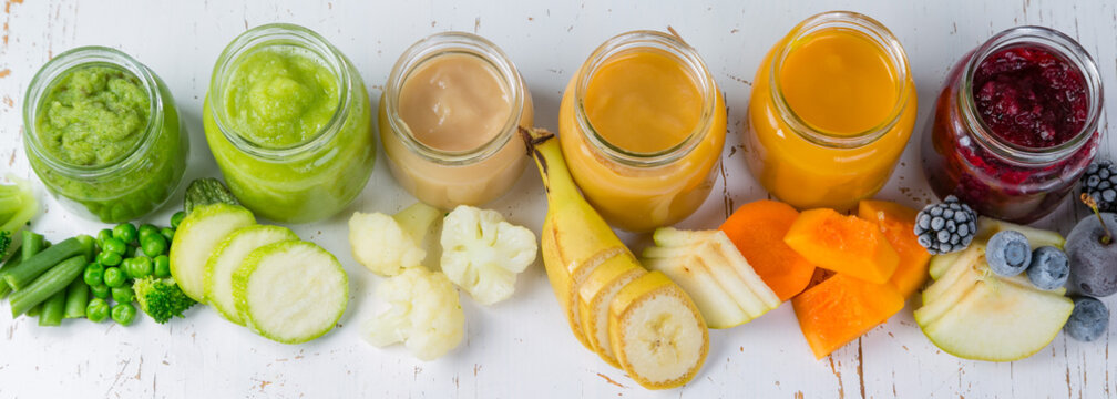 Colorful baby food purees in glass jars