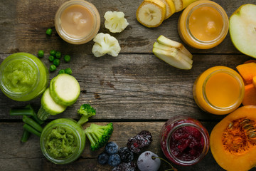 Colorful baby food purees in glass jars