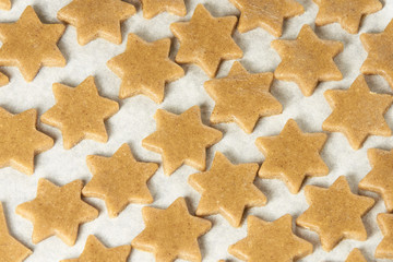 Raw dough. Ginger biscuit star. Cooking