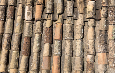 Old fashioned style roof tiles on rural building in Provence France