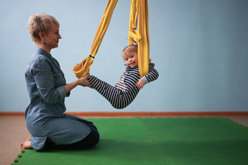 Mom with child Down syndrome engaged in yoga