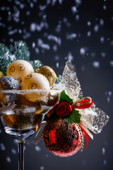 Fototapeta na wymiar Christmas balls in wineglass .
