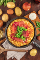 Spanish tortilla with wine, ingredients, and copy space