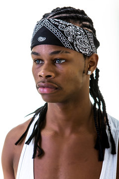 Young black man in do-rag looking away