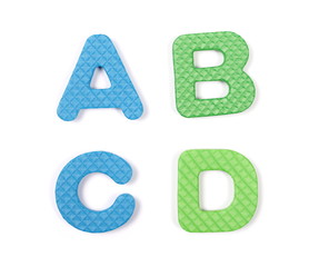 Alphabet letters spelling out abc isolated on white background, top view