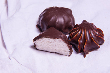 Homemade marshmallowsin the glaze chocolate . zephyr. Handmade sweets.