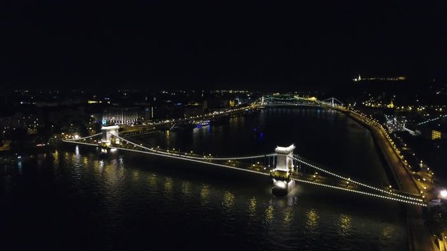 Chain bridge in Budapest aerial approach at night, Budapest, Hungary