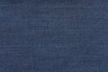 Dark blue jeans texture. Denim fabric background.