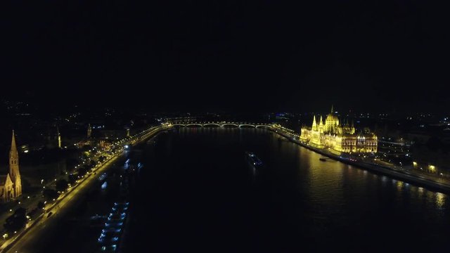 Hungarian parliament building at night aerial zoom out, Budapest, Hungary