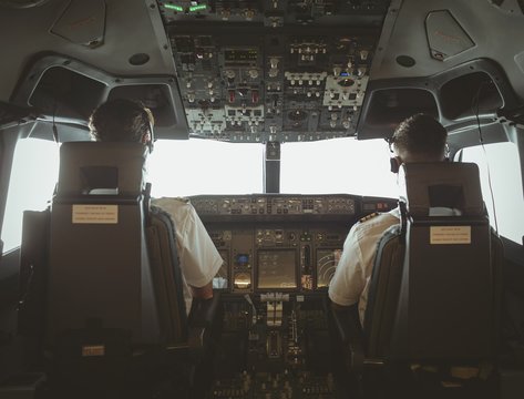 Pilot and copilot flying an airplane