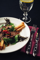 freshly cooked meat and potatoes on a dish