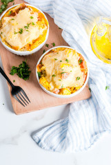 Homemade italian bread casserole strata with cheese, egg and ham, white background copy space top...
