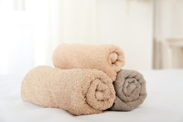 Fototapeta na wymiar Clean towels on bed