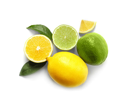 Composition with ripe lemons and limes on white background