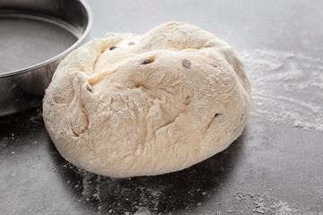 Fresh raw dough on table