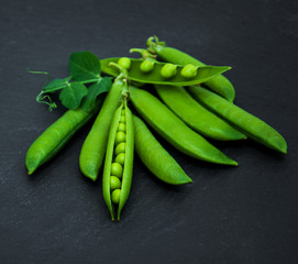 green peas on a stone background