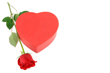 Gift box in the form of heart and scarlet rose isolated on white background.