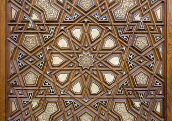 Closeup of arabesque ornaments of an old aged decorated wooden door, Old Cairo, Egypt