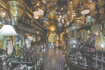 Selection of traditional lamps on sale at a market stall in souks of Marrakech, Morocco.