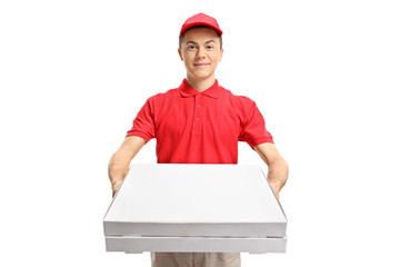Teenage pizza delivery boy giving pizza boxes