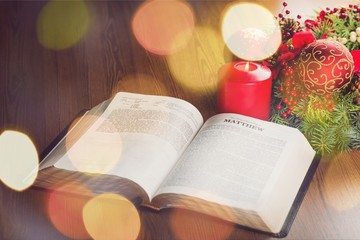 bible with a big candle