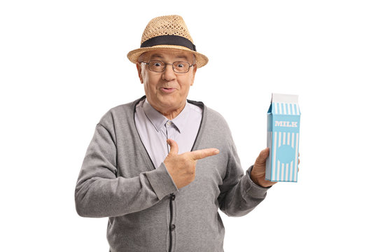 Mature Man Holding A Milk Carton And Pointing