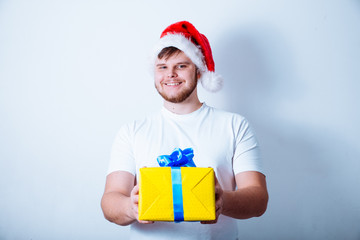man in santa hand holds gift box