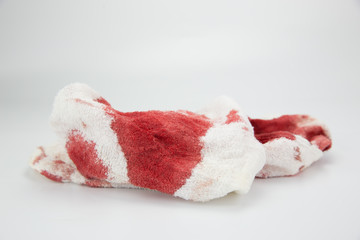 Contains blood stains on a towel, White scene.