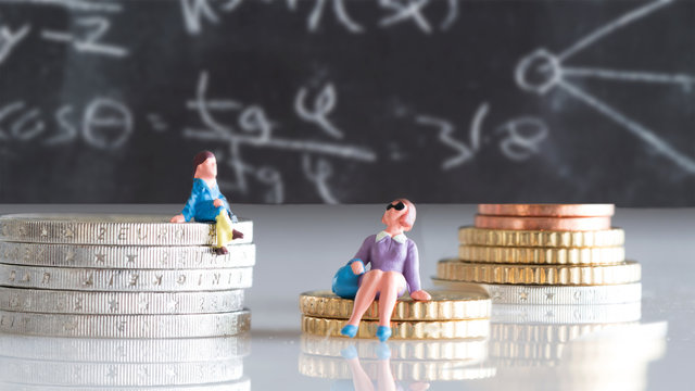 Using a pension calculator - miniature figures, mother and daughter sitting on coins