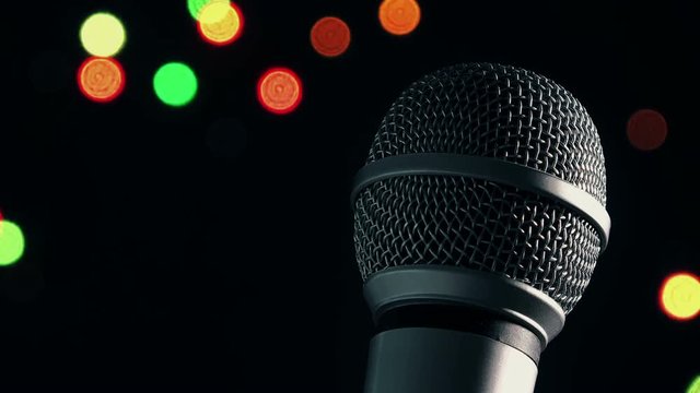 Karaoke night, microphone with bokeh light in background