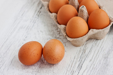 Yellow chicken eggs in package
