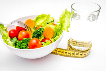 concept diet fresh vegetables on plate at white background