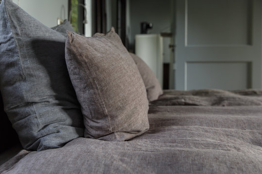 pillows on a bed in a cabin