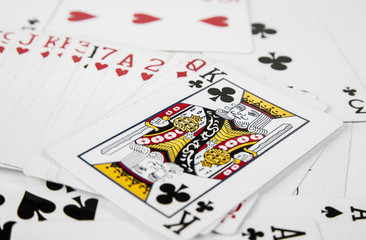 Playing cards spreaded on the white background