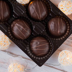 Chocolates and Christmas garlands glow