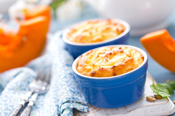 Delicious mini casserole with cottage cheese and pumpkin for breakfast. White background. Closeup