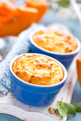 Delicious mini casserole with cottage cheese and pumpkin for breakfast. White background. Closeup