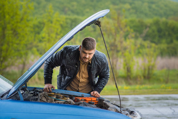 The driver tries to start a car