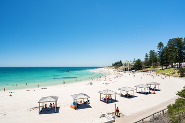 Fototapeta na wymiar A busy Cottesloe Beach, Perth, Western Australia on a beautiful Summer afternoon. Photographed: December 22, 2017.