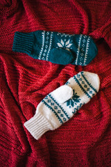 Two knitted mittens.