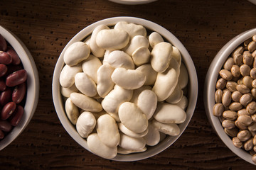 White beans on wood background