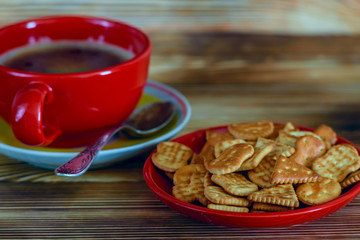 delicious cracker and fresh coffee on a wooden background 