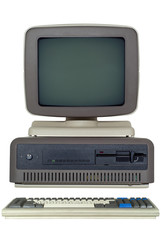 old computer (late 80's) with a horizontal system unit, a drive for six-inch floppy disks and a CRT...