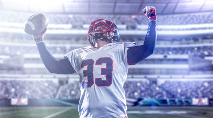 american football player celebrating after scoring a touchdown - obrazy, fototapety, plakaty