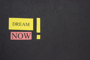 Dream now inscription with exclamation mark