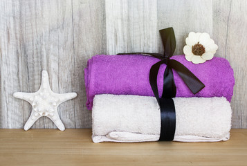 Obraz na płótnie Canvas Towels with a starfish. Concept Beauty Health Spa and Wellness.