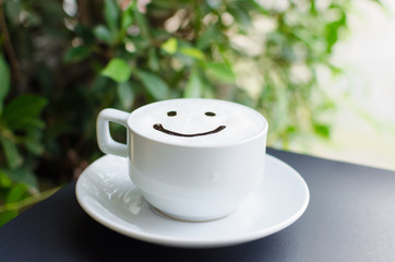 Cappuccino smile in a bright morning glass.