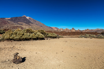 Teide National Park, Tenerife, Canary Islands - colourful soil of the Montana Blanca volcanic ascent trail. This scenic hiking path leads up to the 3718 m Teide Peak, the highest peak in Spain