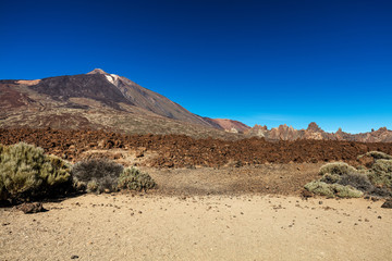 Teide National Park, Tenerife, Canary Islands - colourful soil of the Montana Blanca volcanic ascent trail. This scenic hiking path leads up to the 3718 m Teide Peak, the highest peak in Spain