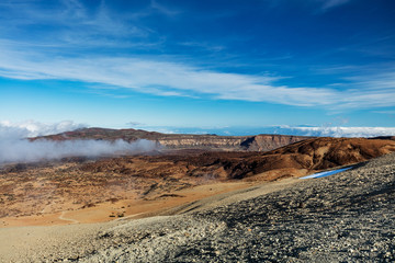 Teide National Park, Tenerife, Canary Islands - colourful soil of the Montana Blanca volcanic ascent trail. This scenic hiking path leads up to the 3718 m Teide Peak, the highest peak in Spain